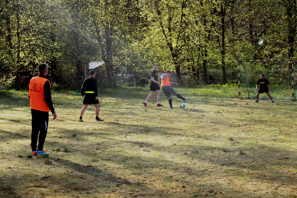 Battle Group Poland soldiers mix it up on soccer field with local students