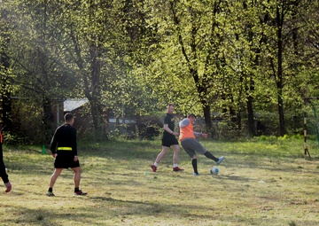 Battle Group Poland soldiers mix it up on soccer field with local students