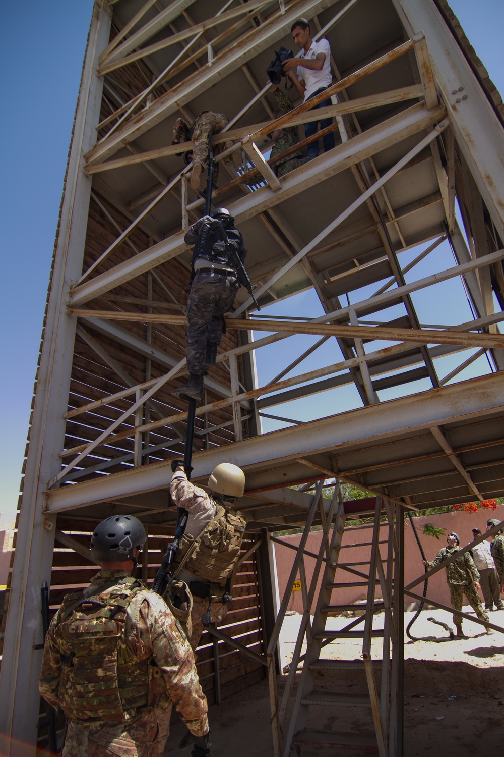 U.S., Italian and Jordanian military members climb repel tower during Eager Lion 17