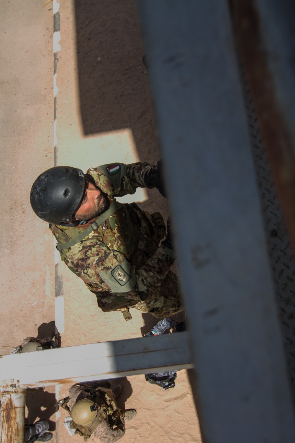 Italian Soldier climbs a repel tower during Eager Lion 17