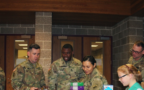 Girl Scouts donate cookies