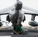 Marine conducts maintenance on an AV-8B Harrier