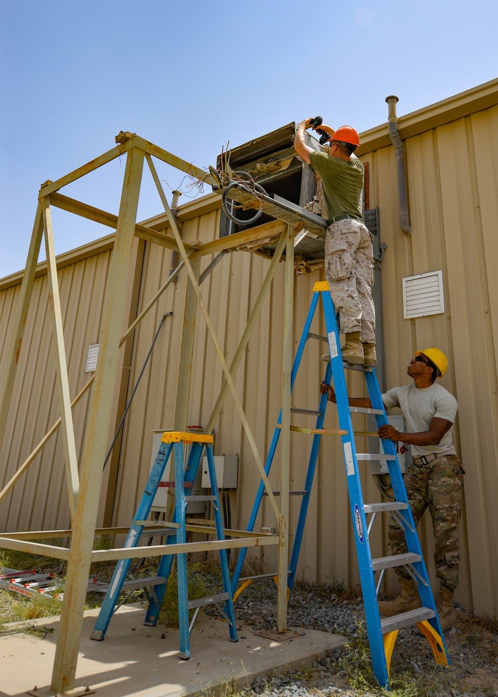 Ladder spotter secures joint task
