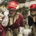 USS America Sailors investigate flooding during a damage control training team evolution