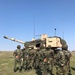 3-29 FA battery trains beside Romanian artillerymen