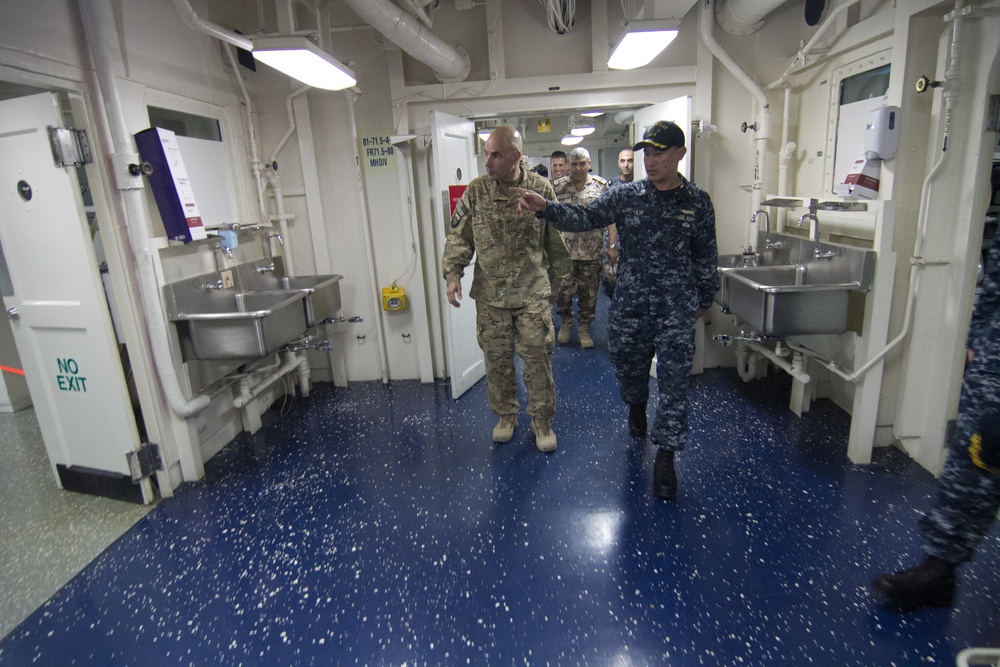 Brig. Gen. Jeffrey Kramer, commanding general, Combined Joint Operations Center/Army Forces-Jordan tours the USS Bataan medical facility during Eager Lion 17