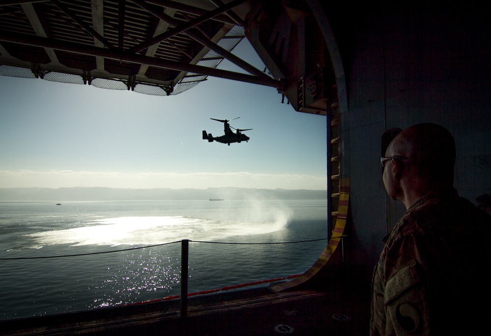Brig. Gen. Jeffrey Kramer, commanding general, Combined Joint Operations Center/Army Forces-Jordan watches a V-22 Osprey aboard the USS Bataan (LHD 5) during Eager Lion 17