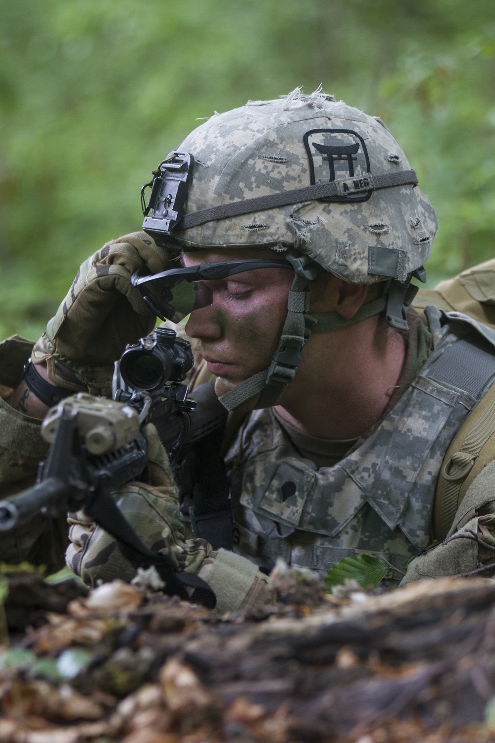 Soldier Pauses to Fix Eye Pro During Training