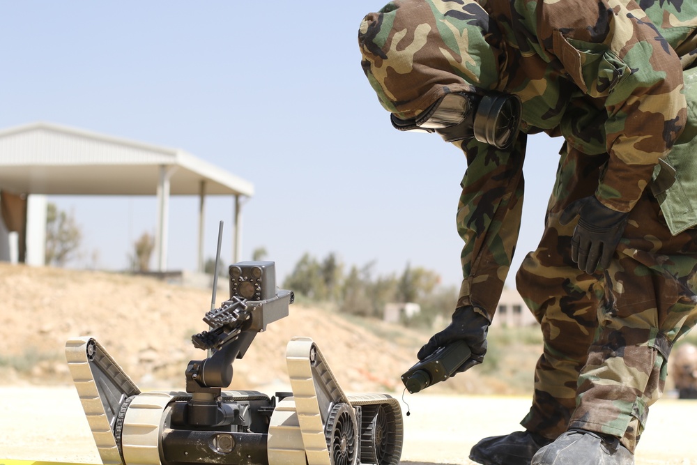 A Jordan Armed Forces soldier checks a recon robot for contamination during a CBRN exercise