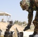 A Jordan Armed Forces soldier checks a recon robot for contamination during a CBRN exercise
