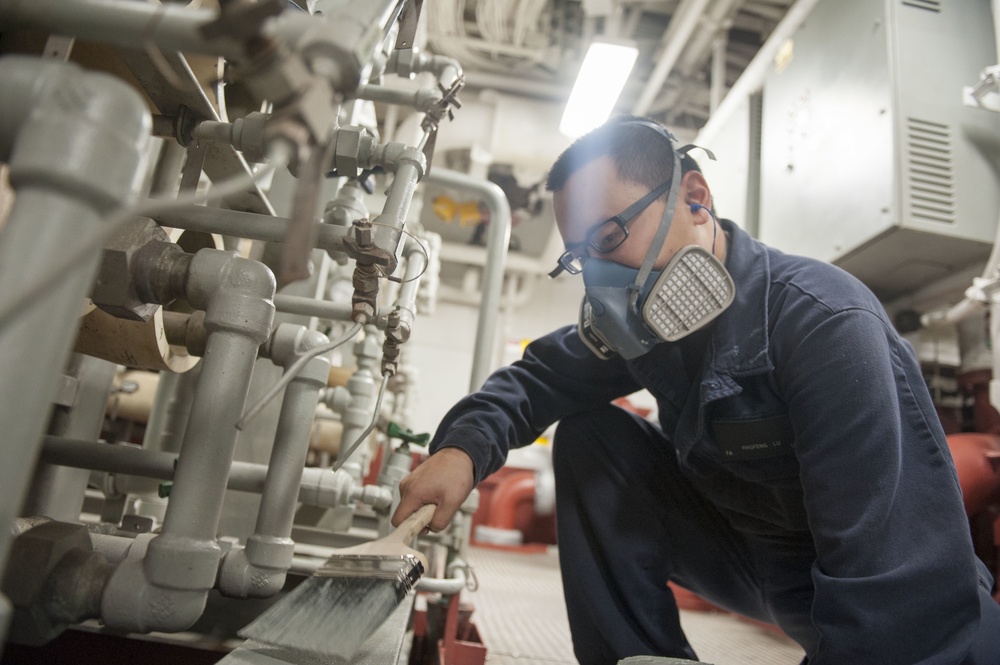 America Sailor paints machinary room