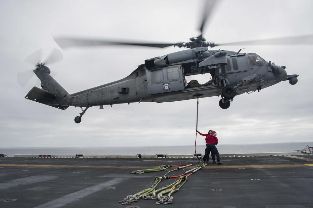 USS America conducts ammo transfer