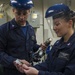 Sailors calibrate presure gage