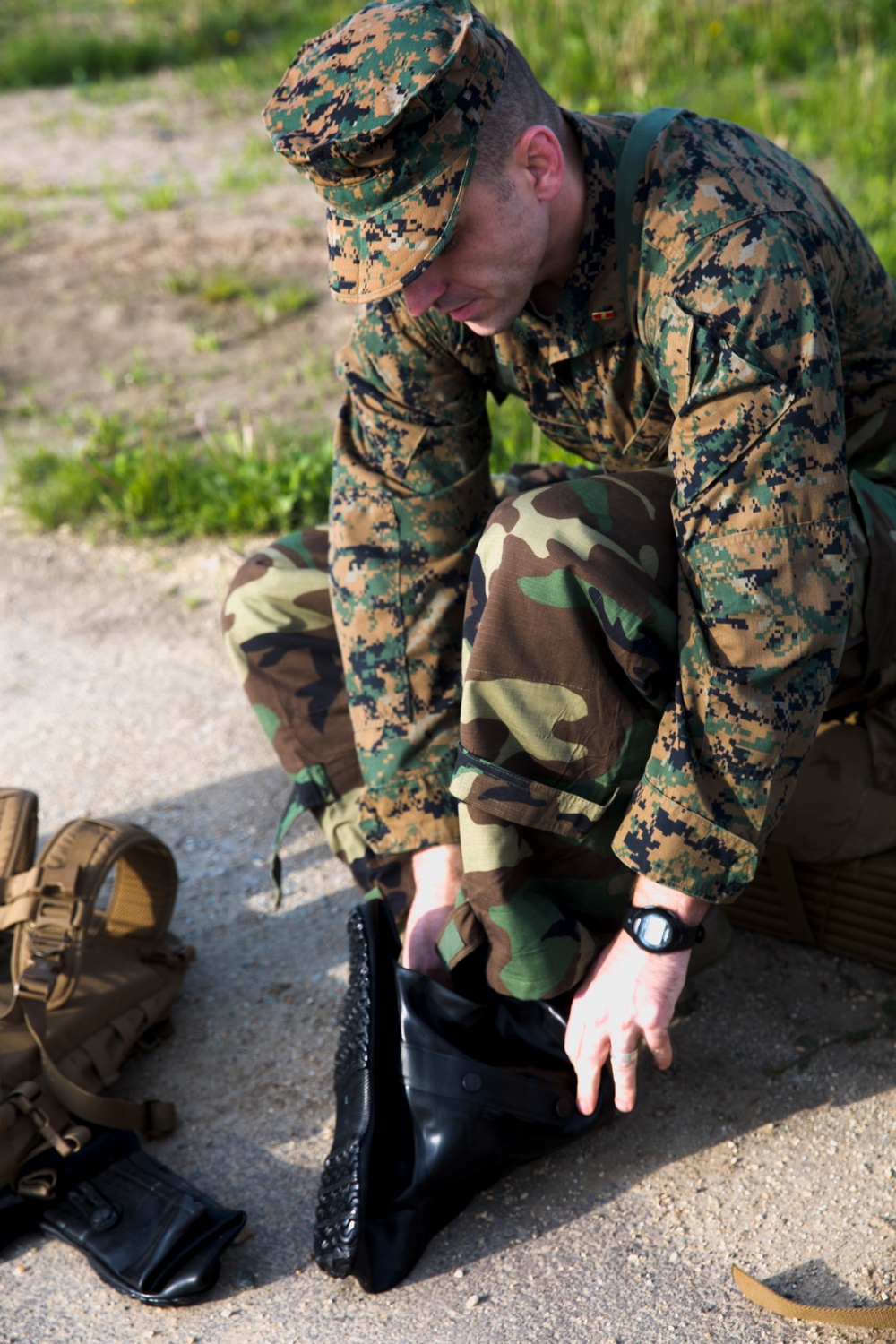 BSRF 17.1 Marines hike in mission oriented protective posture suits