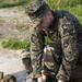 BSRF 17.1 Marines hike in mission oriented protective posture suits