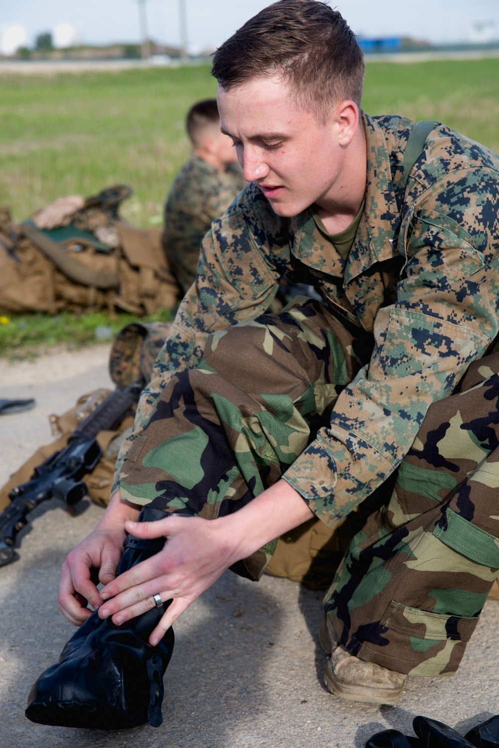 BSRF 17.1 Marines hike in mission oriented protective posture suits