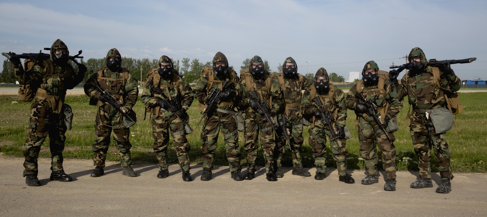 BSRF 17.1 Marines hike in mission oriented protective posture suits