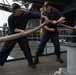 Sailors Heave a Mooring Line