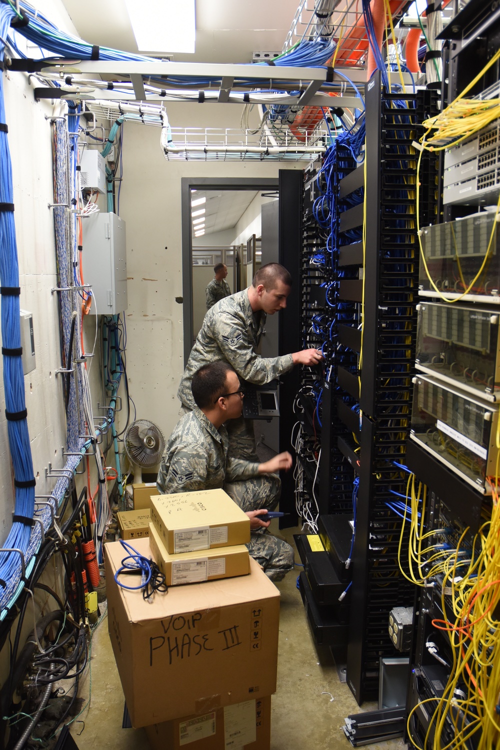 Communications Airmen work base-wide telephone upgrades