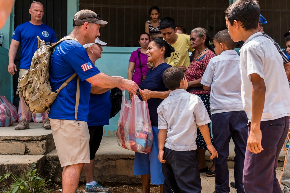 JTF-Bravo hikes over 5000 pounds of food and supplies to San Jerónimo, Comayagua, Honduras.