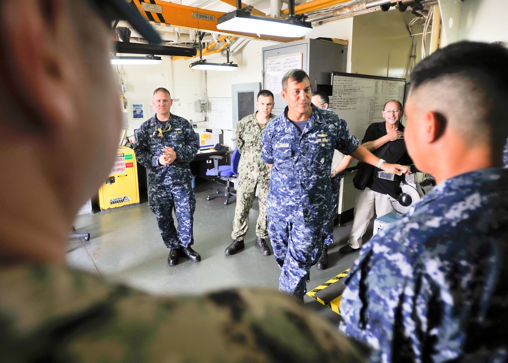 Rear Adm. Stephen Williamson toured USS Emory S. Land (AS 39) and other repair facilities in Guam to assess current operations and capabilities.
