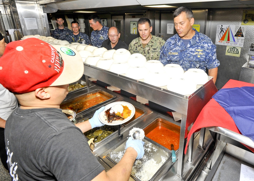 Rear Adm. Stephen Williamson toured USS Emory S. Land (AS 39) and other repair facilities in Guam to assess current operations and capabilities.