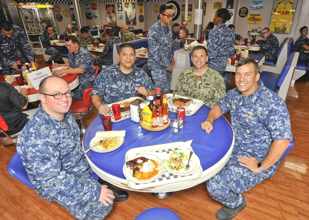 Rear Adm. Stephen Williamson toured USS Emory S. Land (AS 39) and other repair facilities in Guam to assess current operations and capabilities.