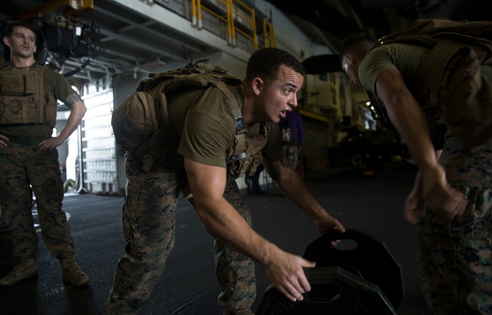 Marines with the 24th MEU conduct physical training underway