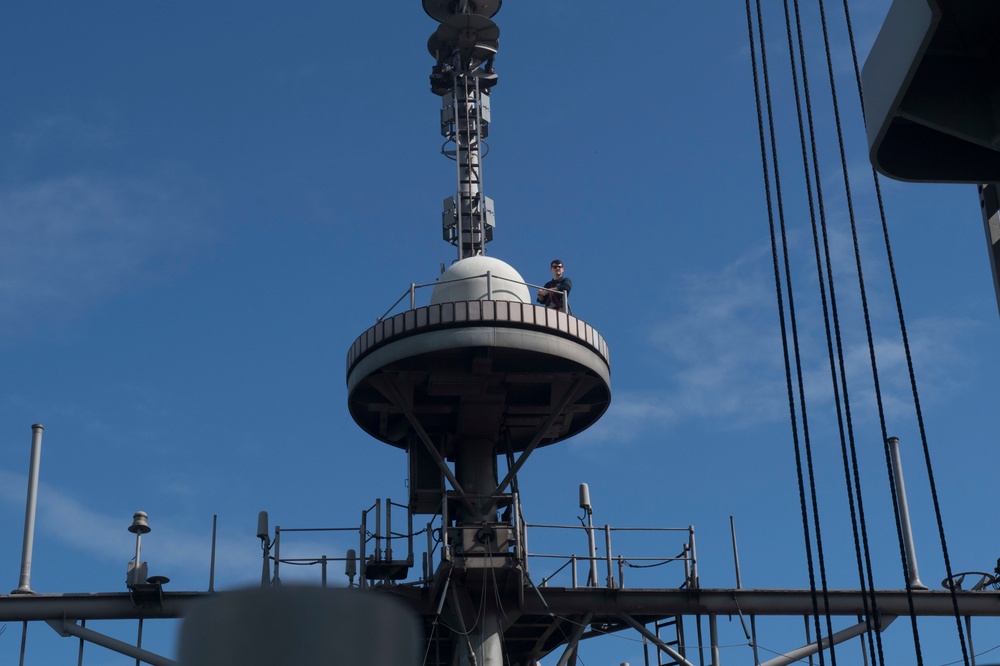 USS Lake Erie (CG 70) Sailors works afloft