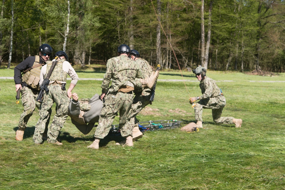 SOCEUR U.S. Sailors and Airman train insertion and extraction techniques utilizing an MV-22 Osprey