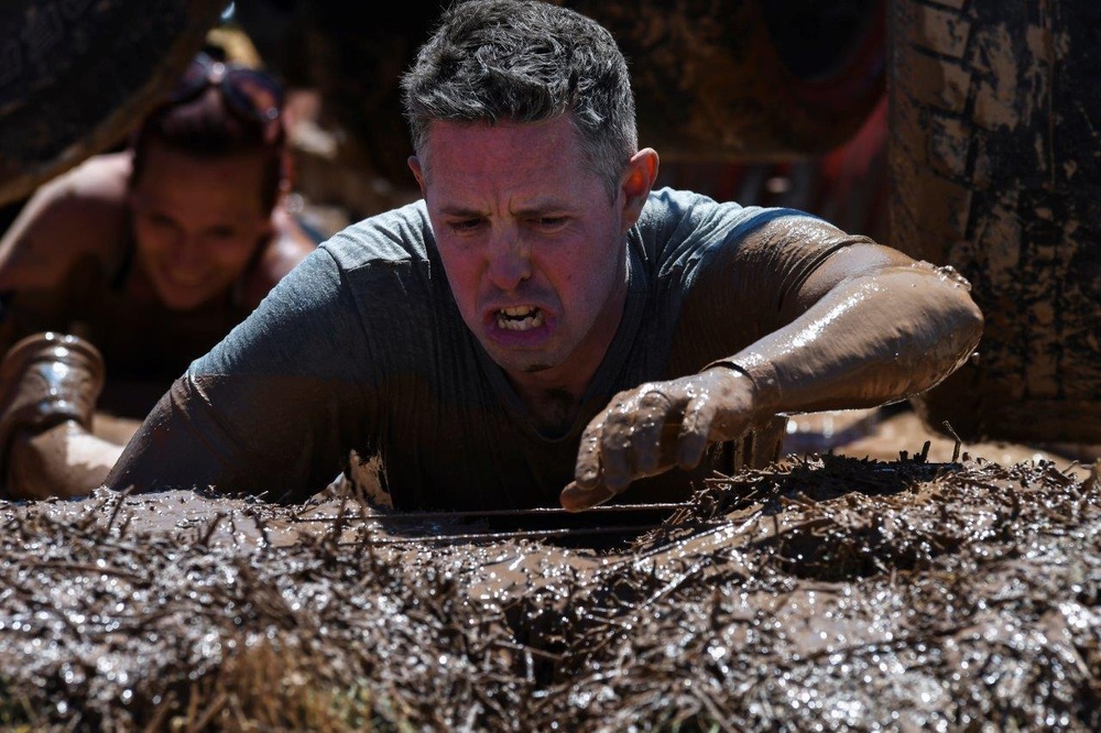 Old Ironsides Mud Challenge Soldiers, friends and family dive in