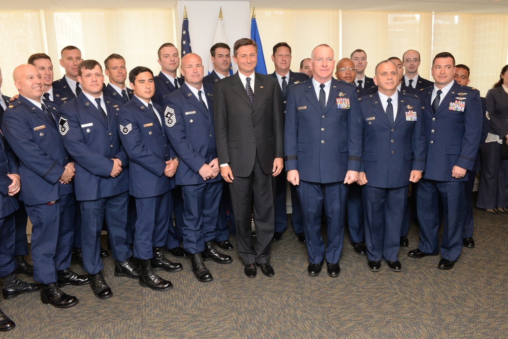 Members of the New York Air National Guard's 106th Rescue Wing get presidential recognition from Slovenia for April 24th international rescue mission