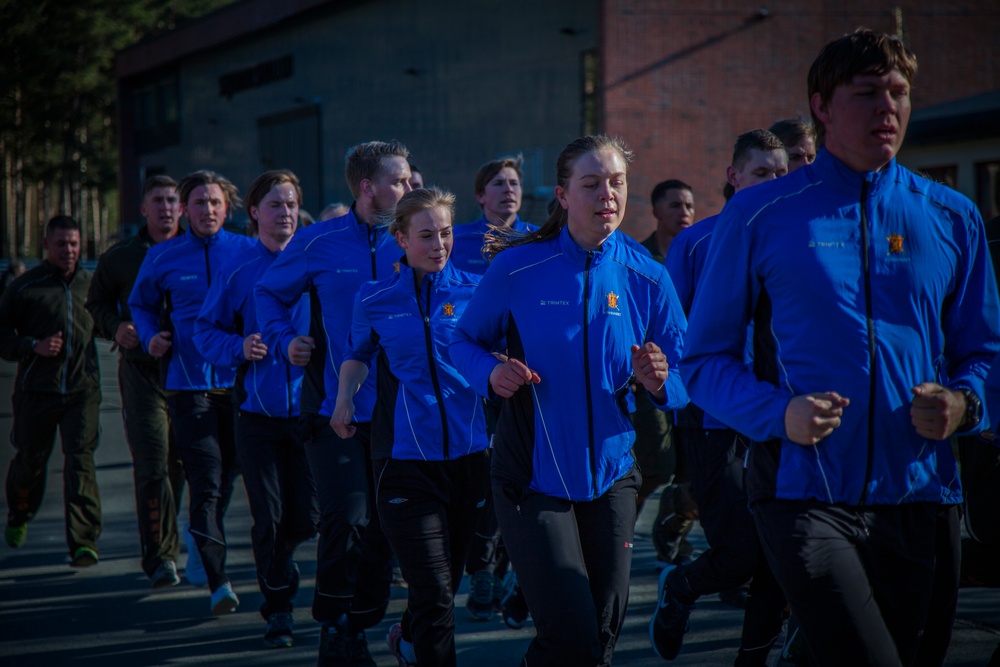 Up in the morning with the Norwegian sun: U.S. Marines and Norwegian soldiers conduct moto run