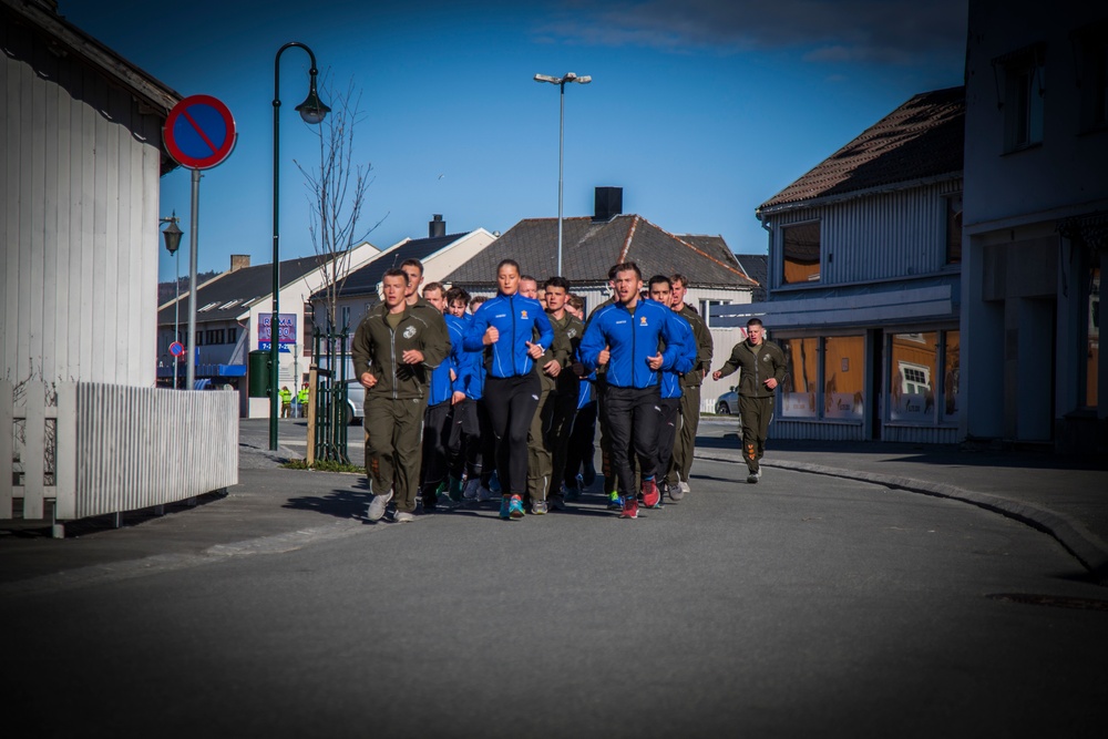 Up in the morning with the Norwegian sun: U.S. Marines and Norwegian soldiers conduct moto run
