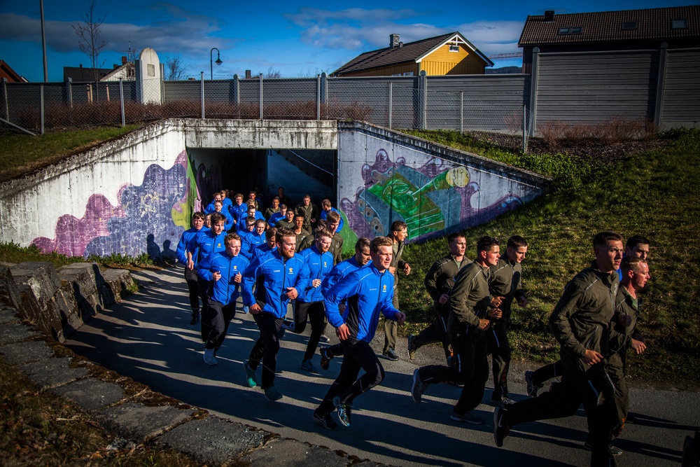 Up in the morning with the Norwegian sun: U.S. Marines and Norwegian soldiers conduct moto run