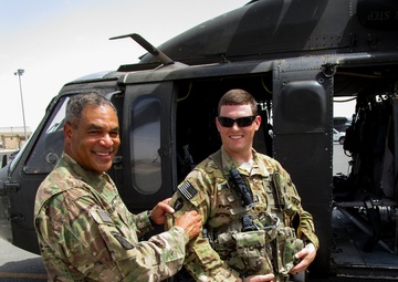 Blackhawk crew chiefs receive combat patch from U.S. Army Central Commanding General