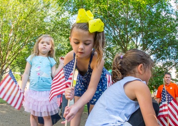 Little girls and American flags
