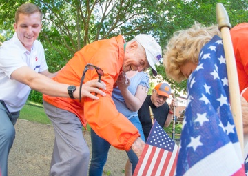 Ben Skardon places flag for Otis Morgan