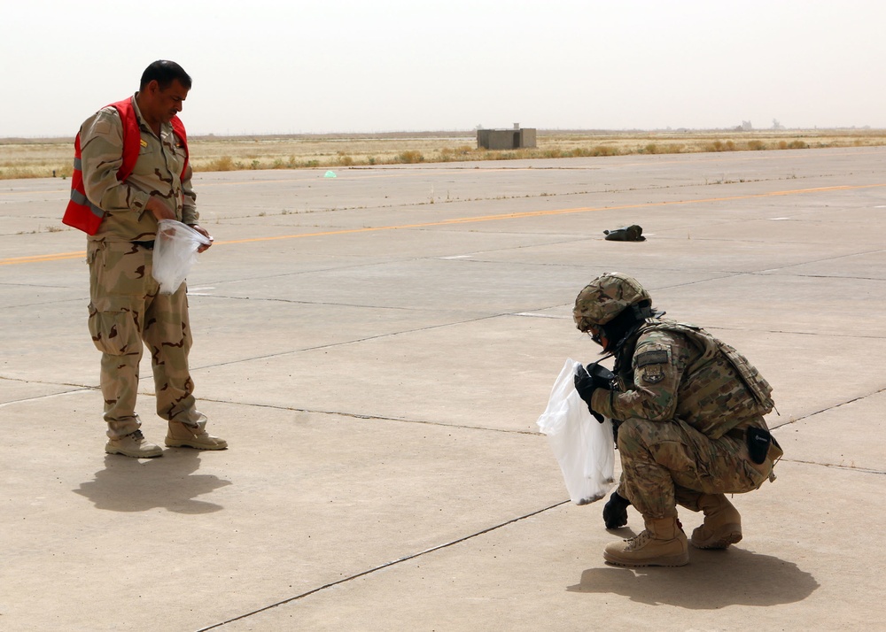 U.S. Air Force Airmen work together with Iraqi Air Force