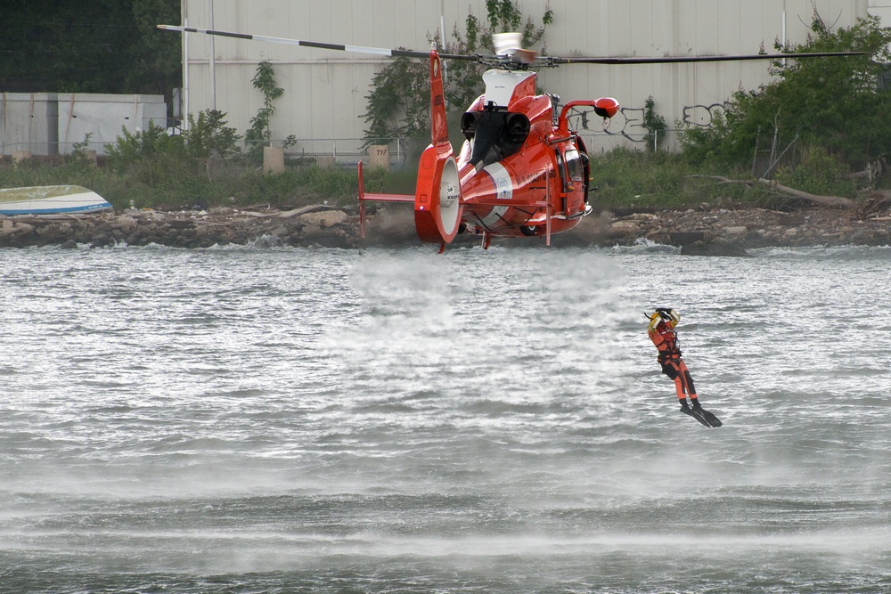 Cost Guard rescue swimmer jumps from HH-65 Dolphin