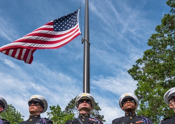 An honor guard and Old Glory