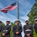 An honor guard and Old Glory