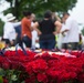 Memorial Flowers Foundation Volunteers Lay Roses at Headstones