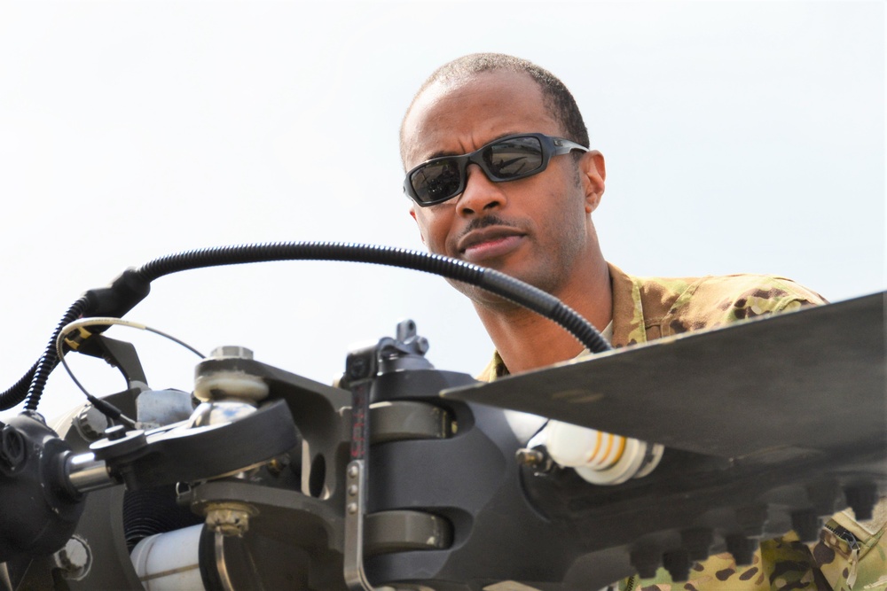 Soldier Inspecting rotor section of Black Hawk
