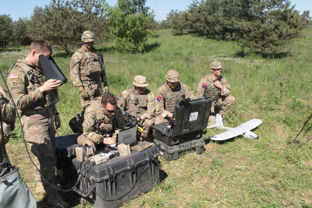 U.S. and U.K. soldiers put “The Eye In The Sky” during a joint UAV mission