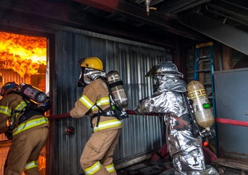 U.S., ROKAF firefighters battle the blaze during fire training
