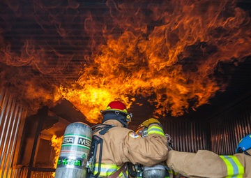 U.S., ROKAF firefighters battle the blaze during fire training