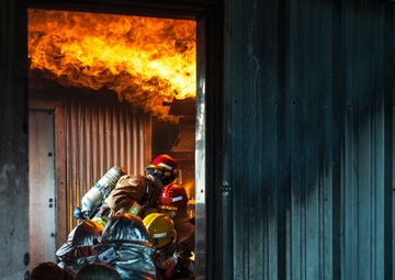 U.S., ROKAF firefighters battle the blaze during fire training