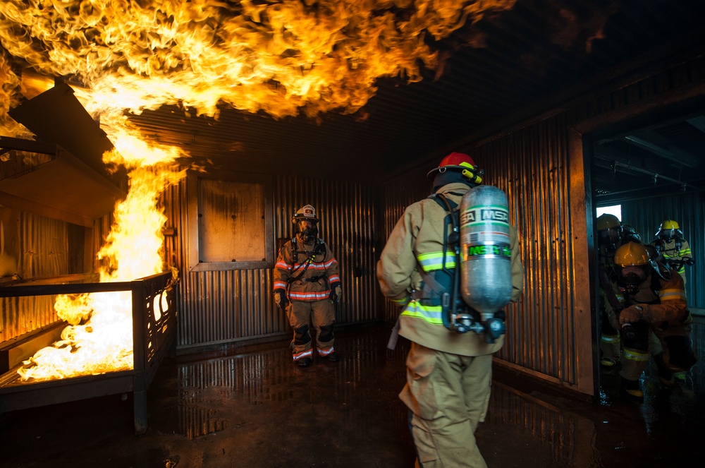 U.S., ROKAF firefighters battle the blaze during fire training