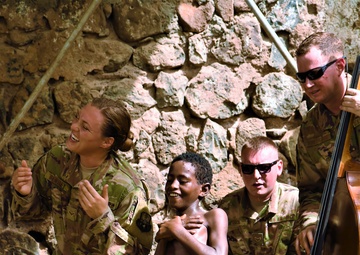 Caritas kids boogie, bond with AFCENT Band during Djibouti tour